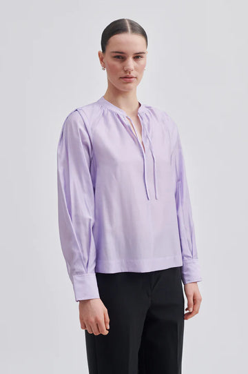 Lilac tie neck shirt from second female. small stand  up collar and key hole opening. Buttoned cuffs, single straight hem. 