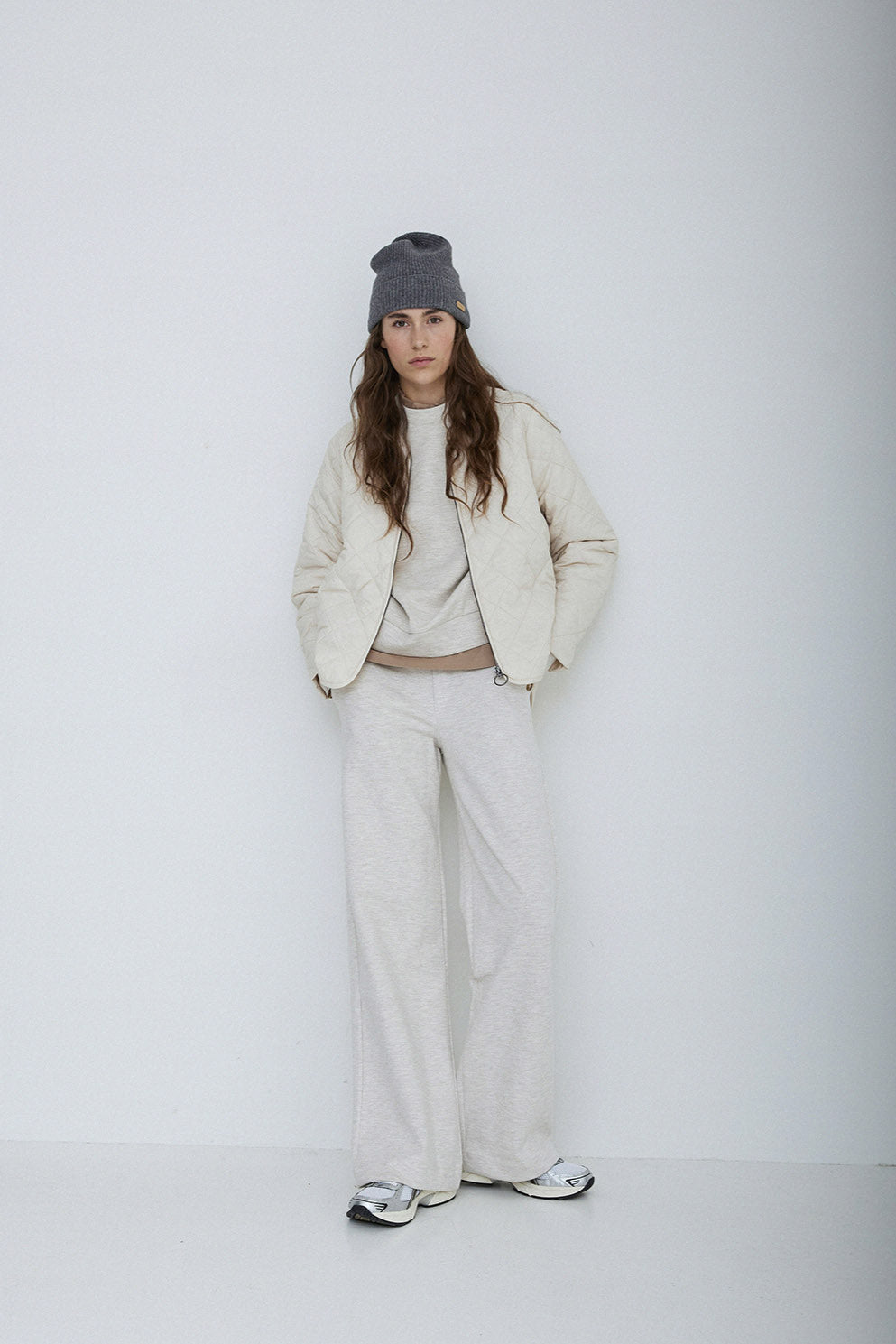 Long sleeve quilted jacket with front zip in natural colour way.
