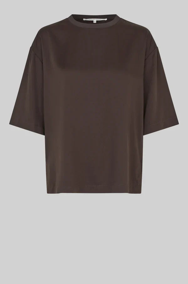 A dark brown short-sleeve crewneck top with a relaxed, oversized fit, displayed against a solid light background.