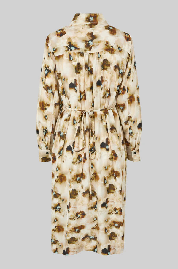 Long sleeve midi dress with long sleeves and all over floral print on a beige base. 