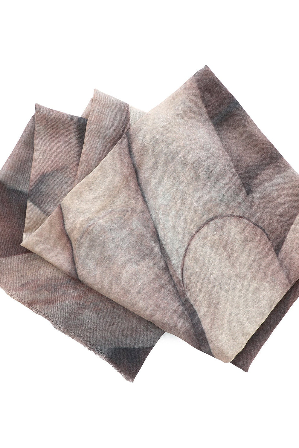 Set of folded wool scarf fabric with a gradient pattern on a white background