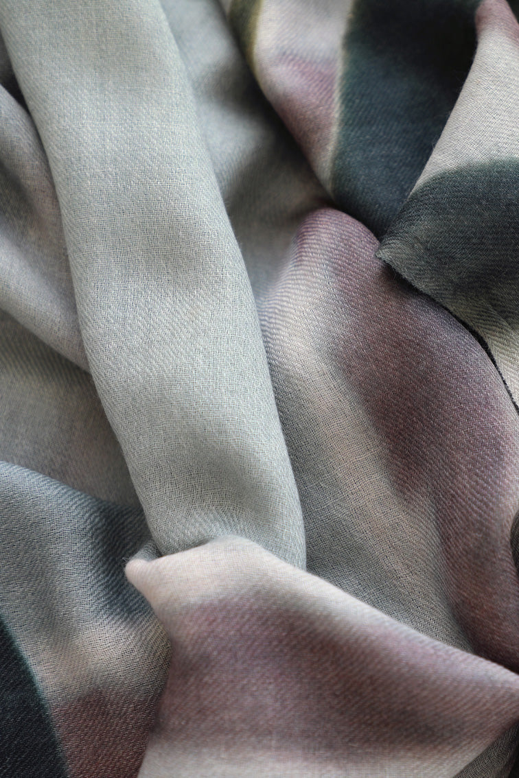 Close-up of wool scarf fabric with brown, beige, and pink colours.