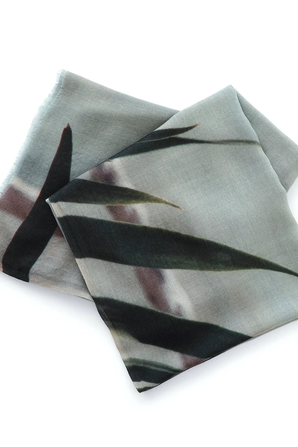 Folded fabric with black abstract pattern on a white background
