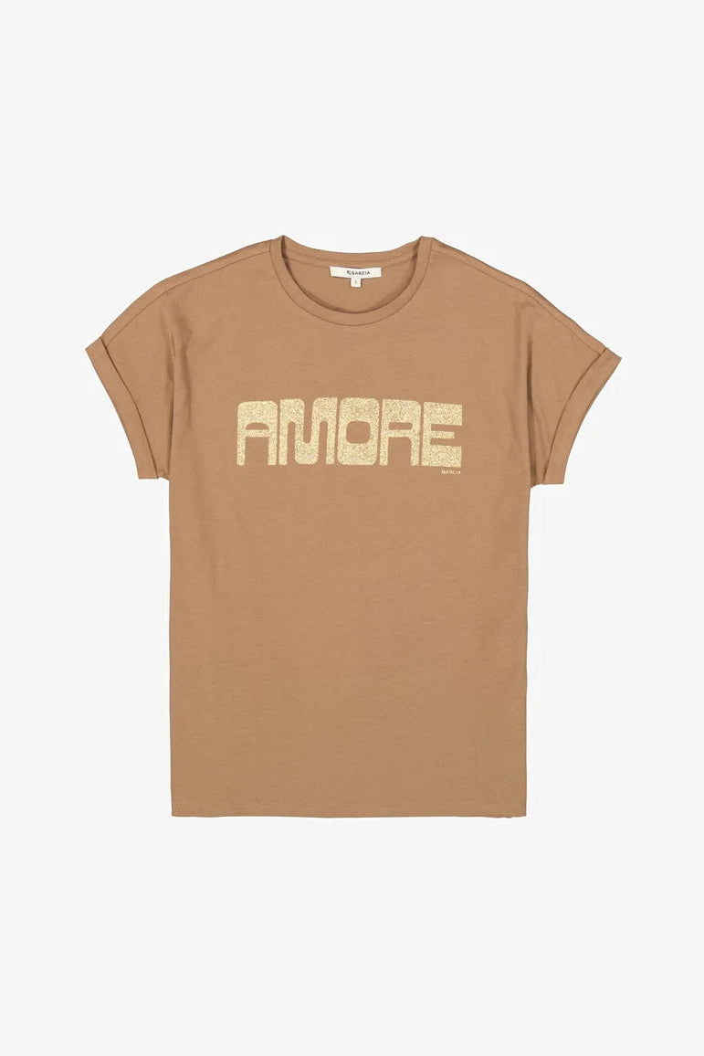 A tan crewneck t-shirt with 'AMORE' printed across the chest in a distressed beige font, displayed flat against a light gray background.