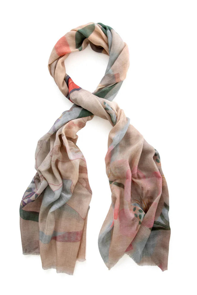 Colourful wool scarf in pink and purple tones with pattern tied. 