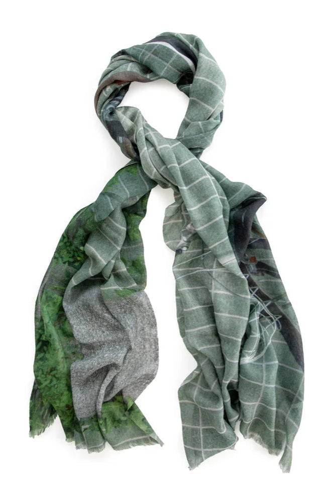 Wool scarf in grey and green tones. Tied. 