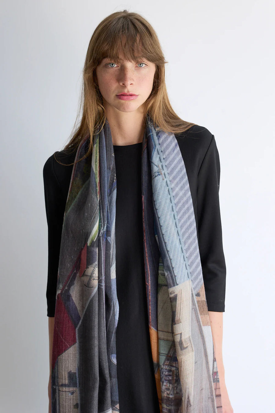 Multicoloured wool scarf Blue and mustard tones.  Model. 