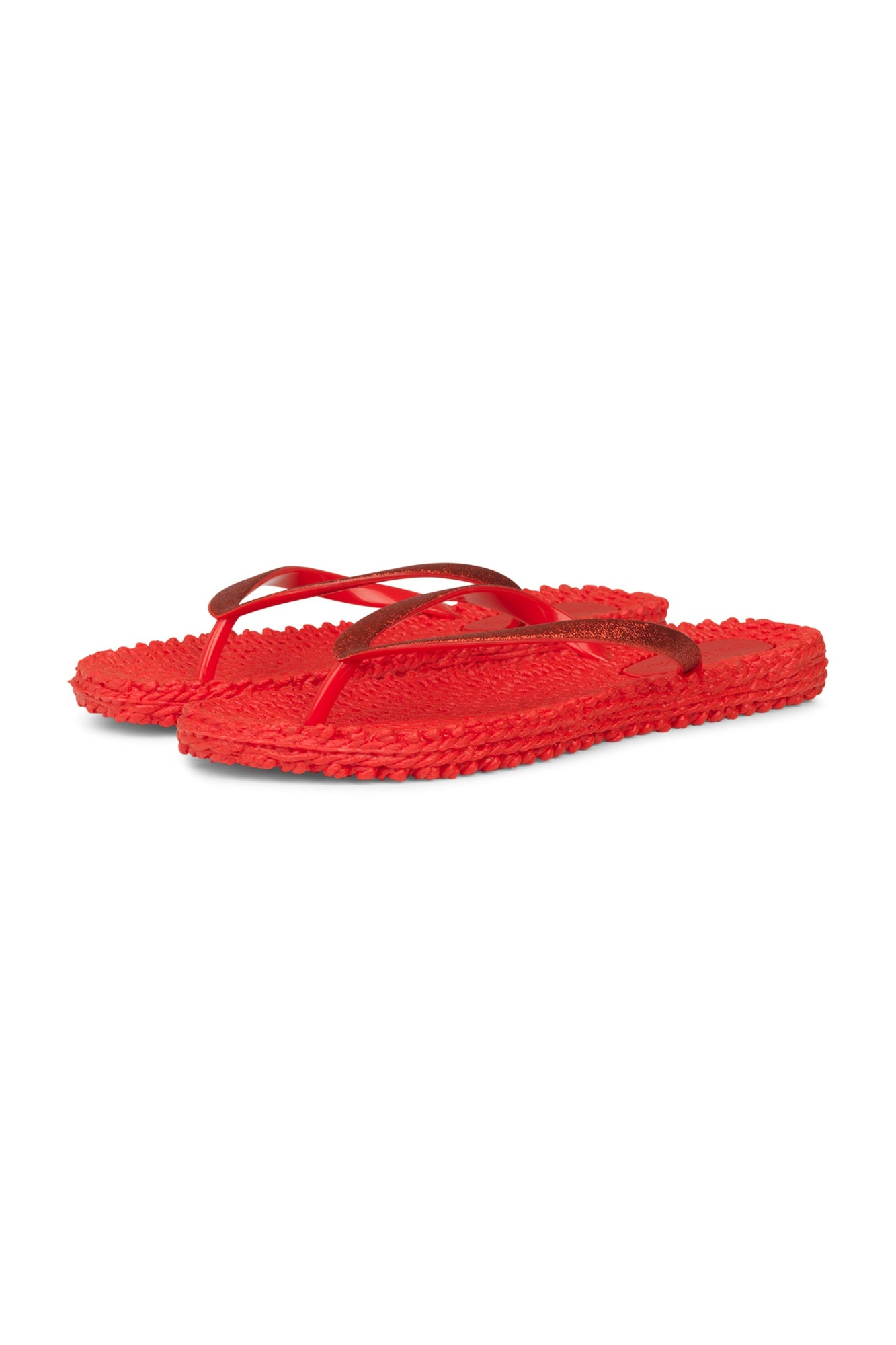 Red flip-flops on a white background