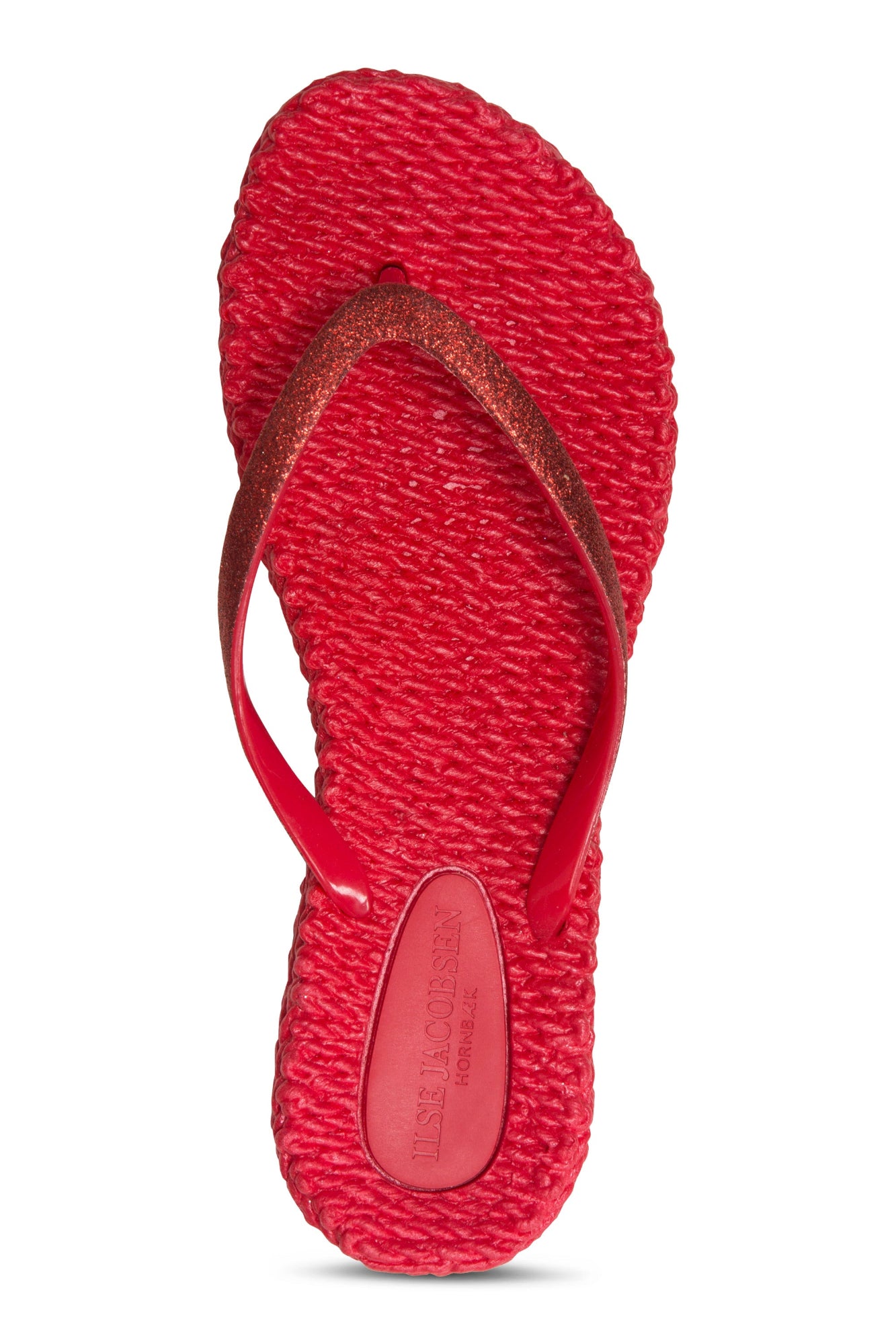 Red sandal with textured strap on a white background