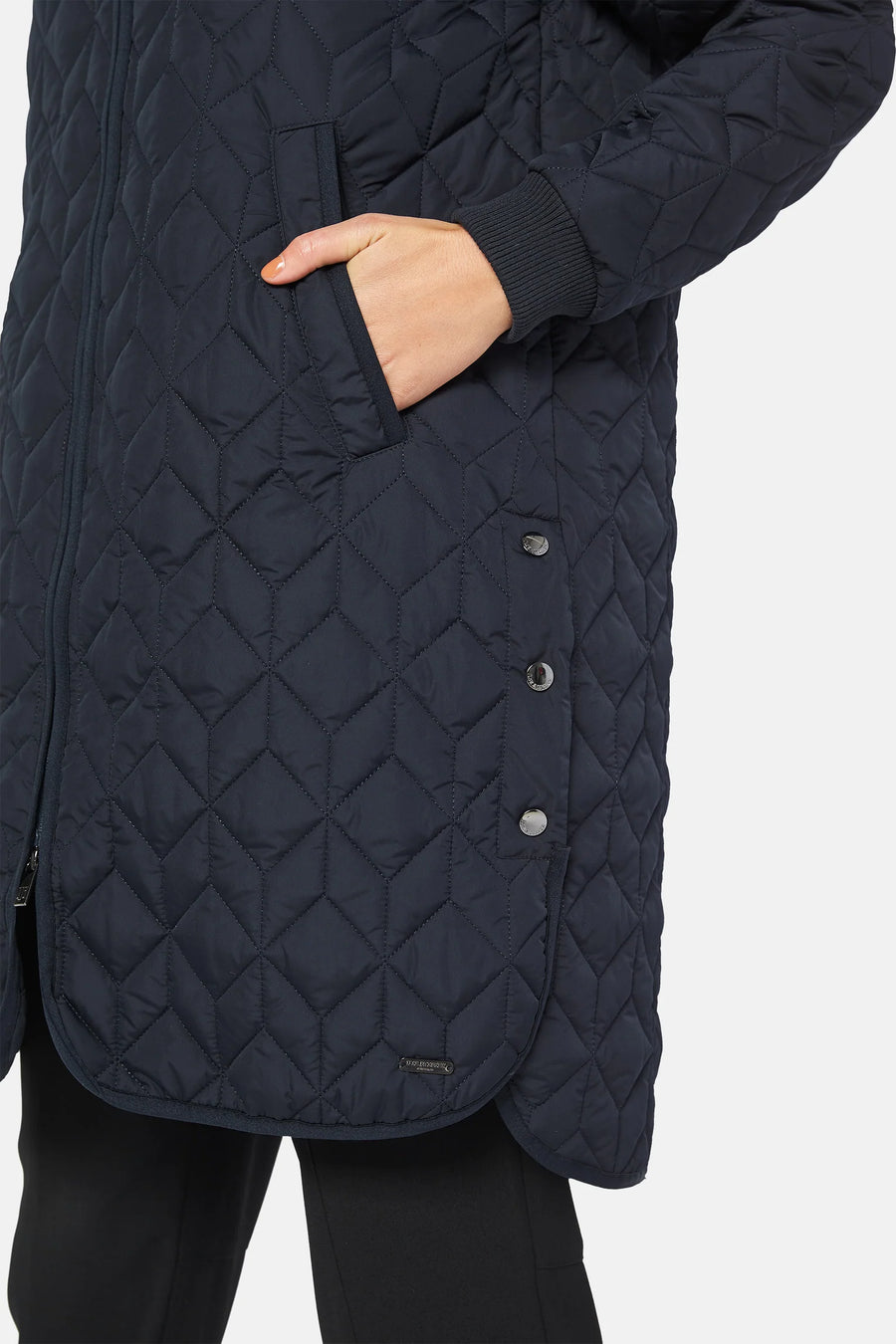 Quilted knee length coat with silver stud detail at splits. 
