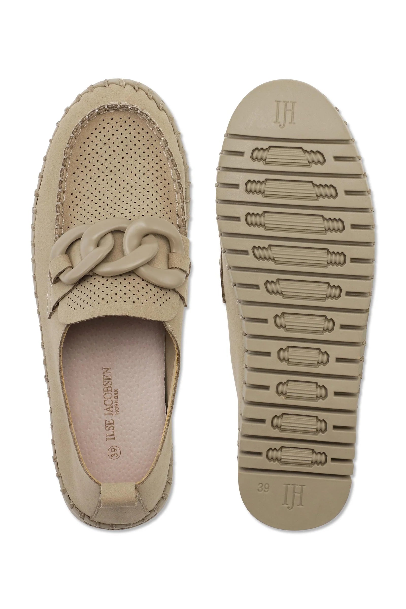 Beige loafer shoe with a textured sole on a white background