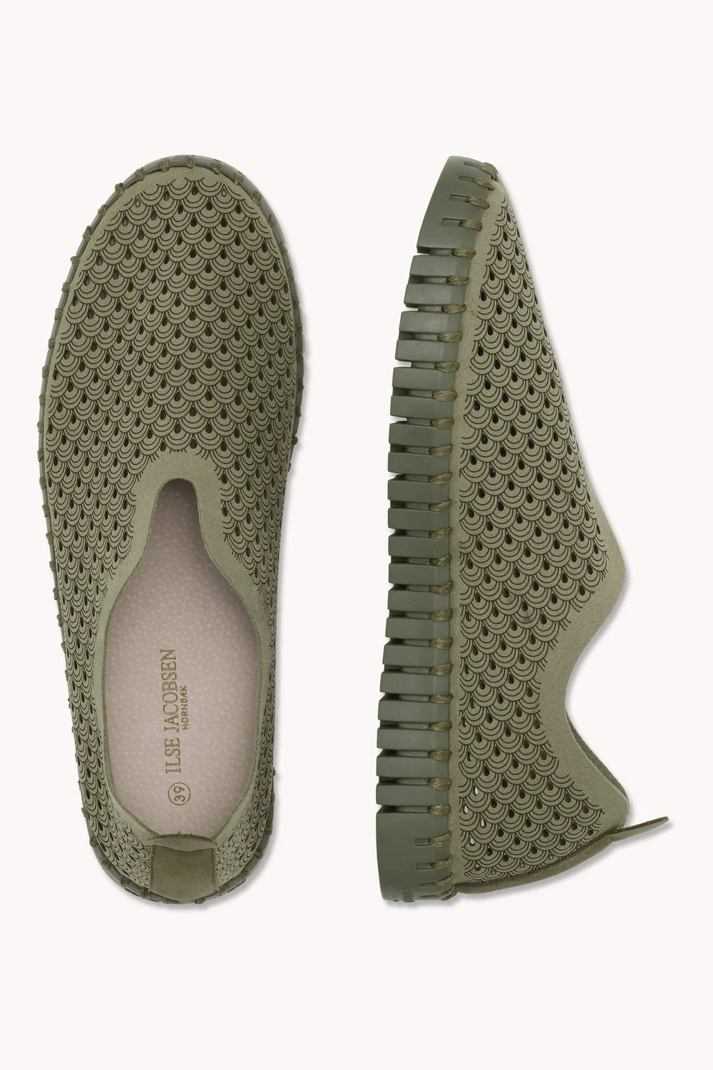 A pair of slip on Tulip shoes by Isle Jacobsen in olive green with slightly darker sole  showing the lazer cut detailing on a plain background. 