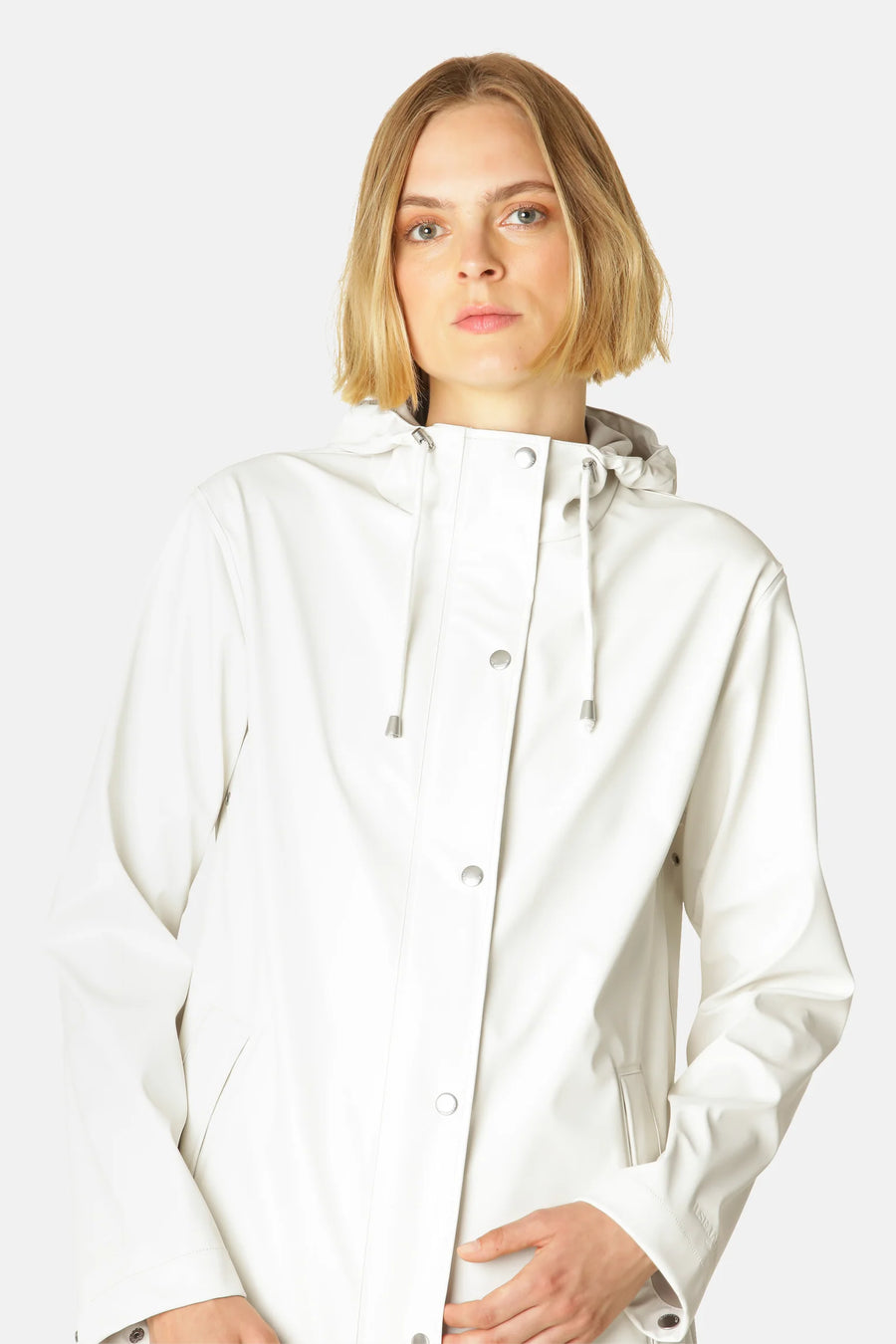 Cream rain jacket with hood and silver dome details 