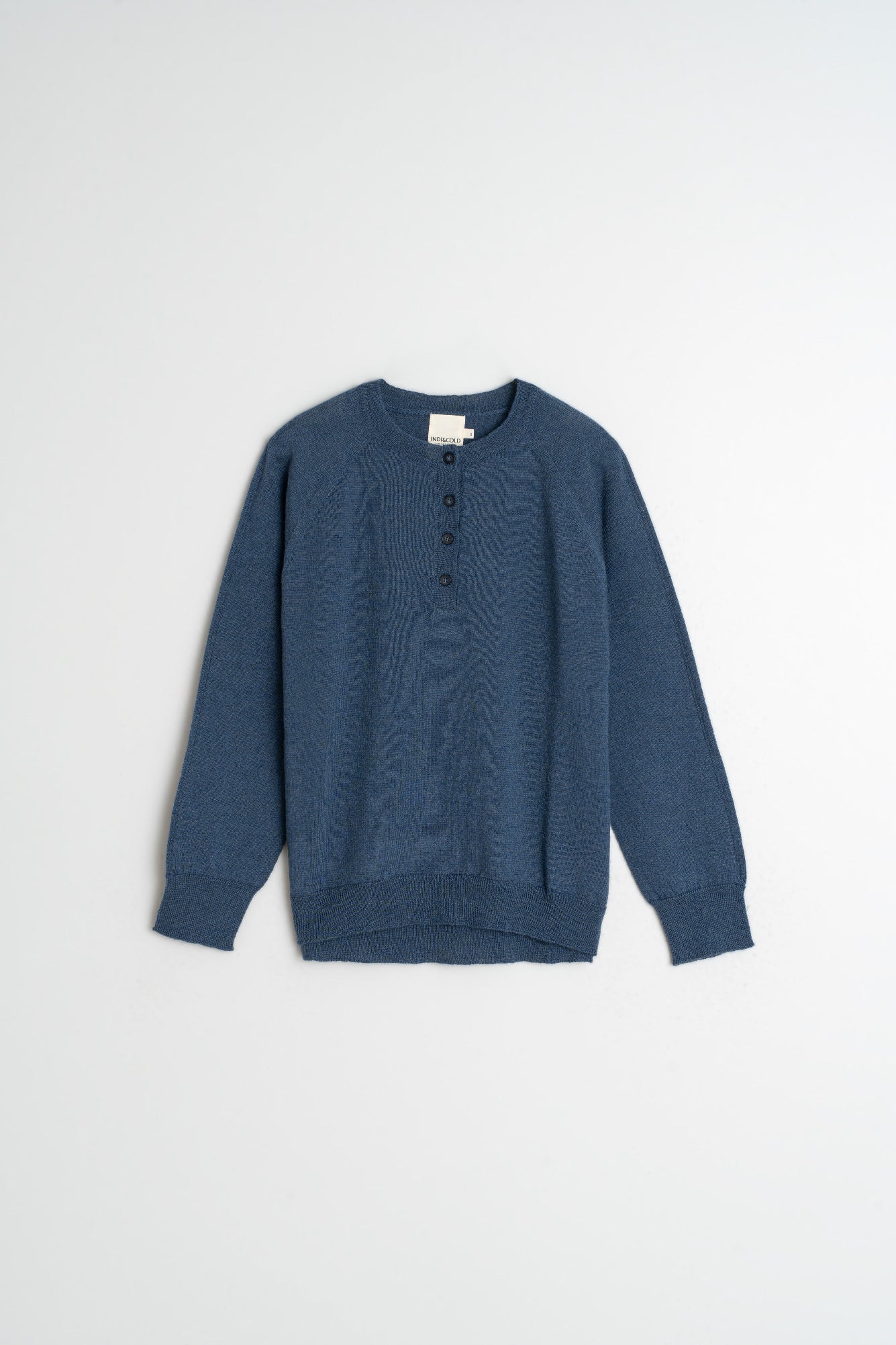 Blue sweater on a light gray background