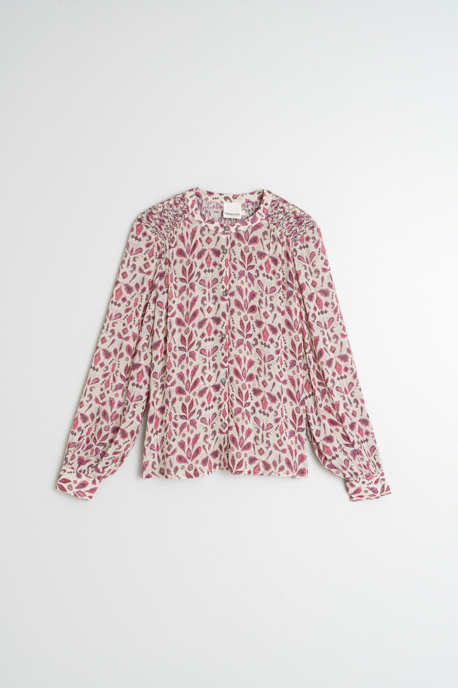 Floral patterned blouse on a white background