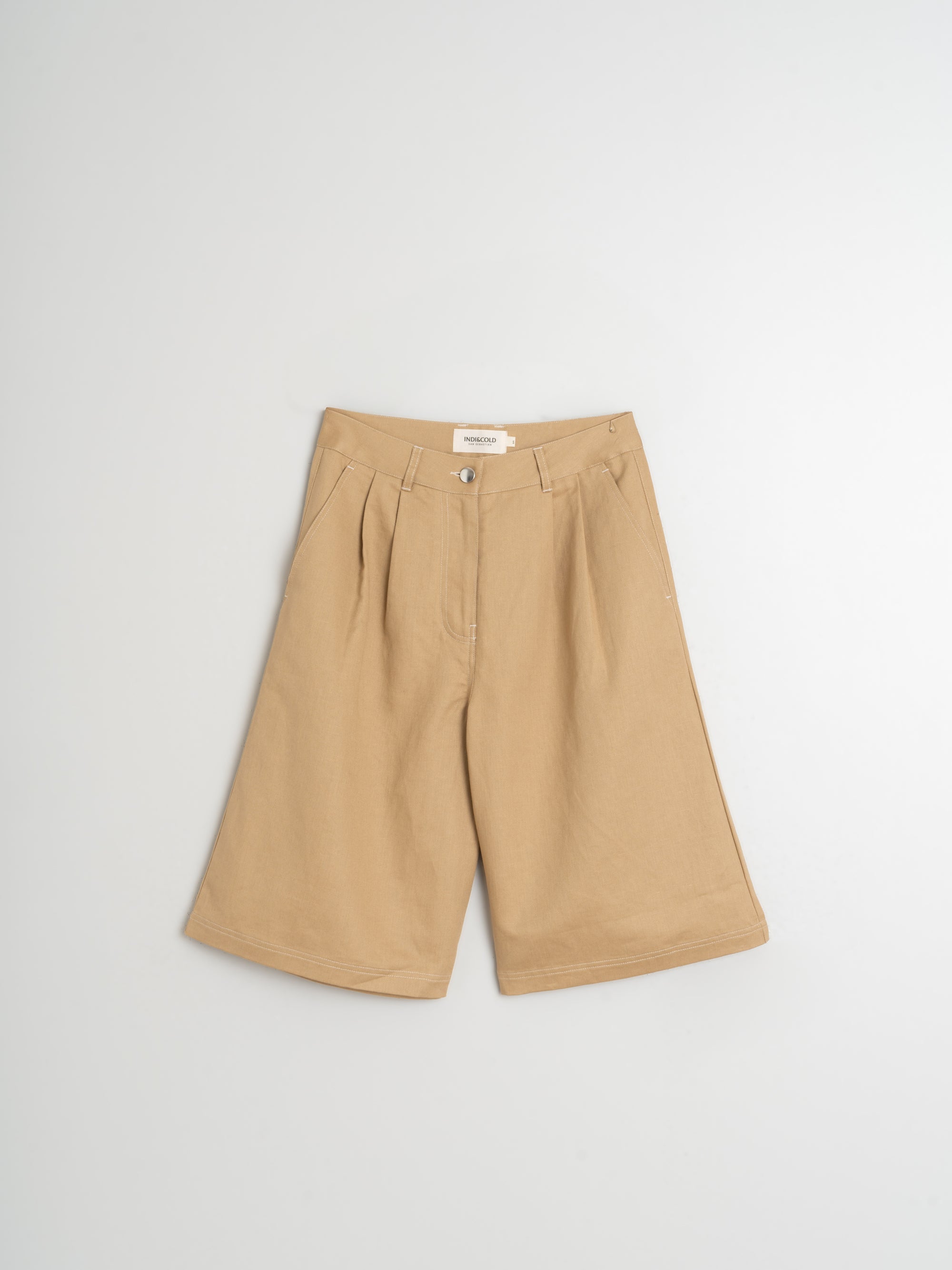 Beige wide-leg bermuda shorts on a light grey background