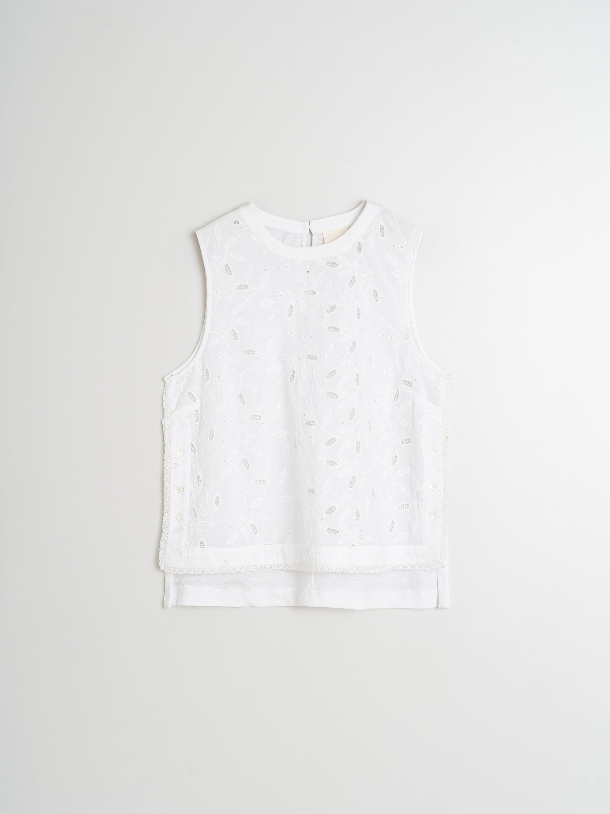 White sleeveless top on a light gray background