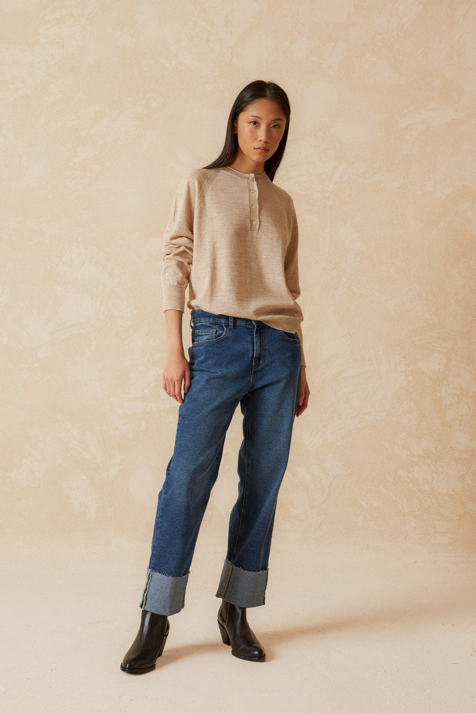 Round neck beige merino wool top with raglan cut neckline and long sleeves. 