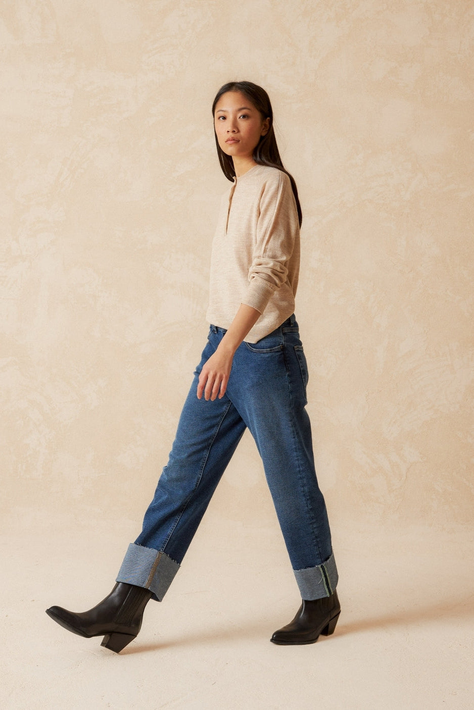 Round neck beige merino wool top with raglan cut neckline and long sleeves. 