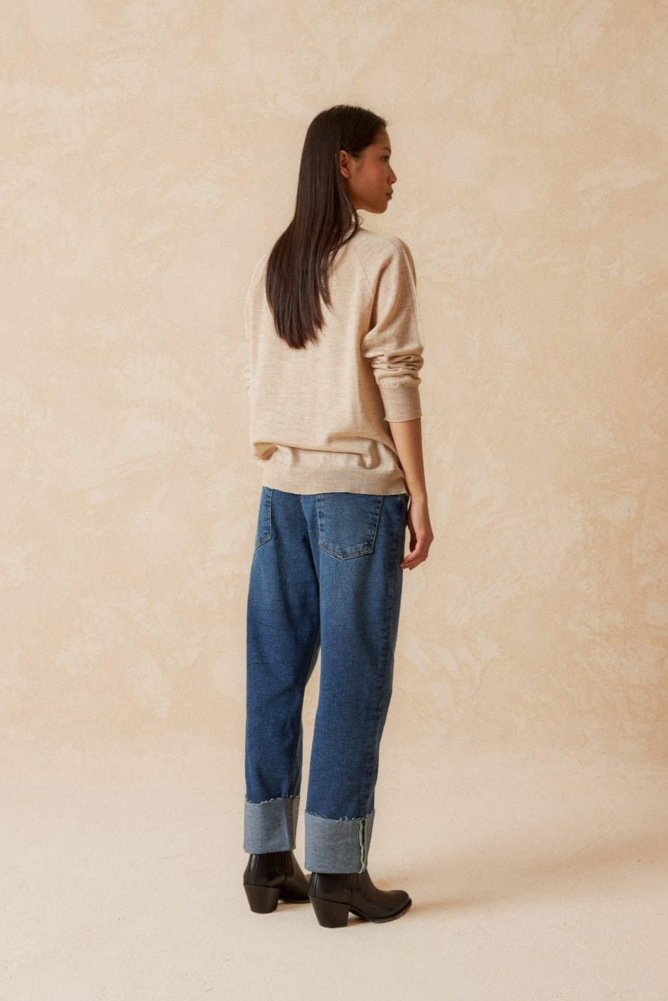 Round neck beige merino wool top with raglan cut neckline and long sleeves. 