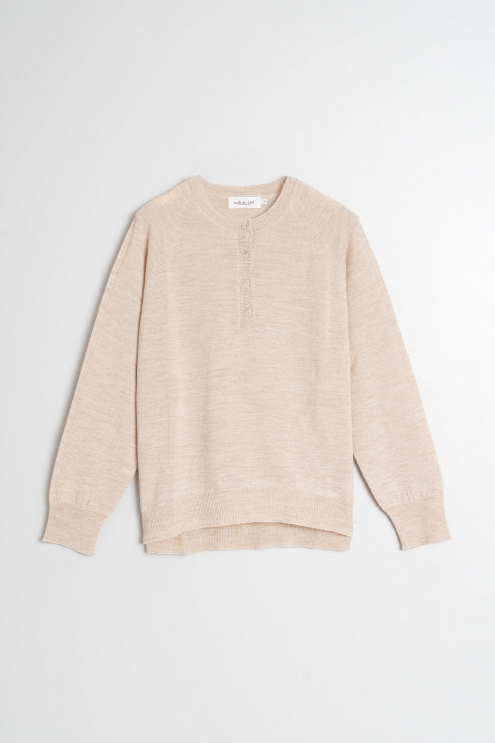 Round neck beige merino wool top with raglan cut neckline and long sleeves. 