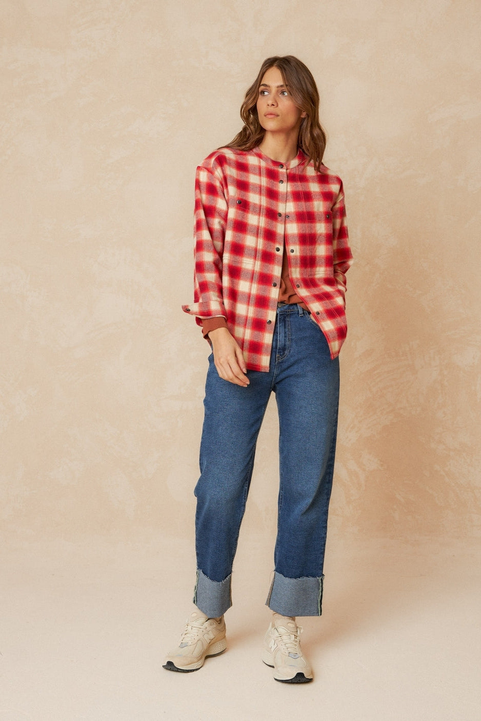 Red and white checkered over shirt with strip collar and square cut. 