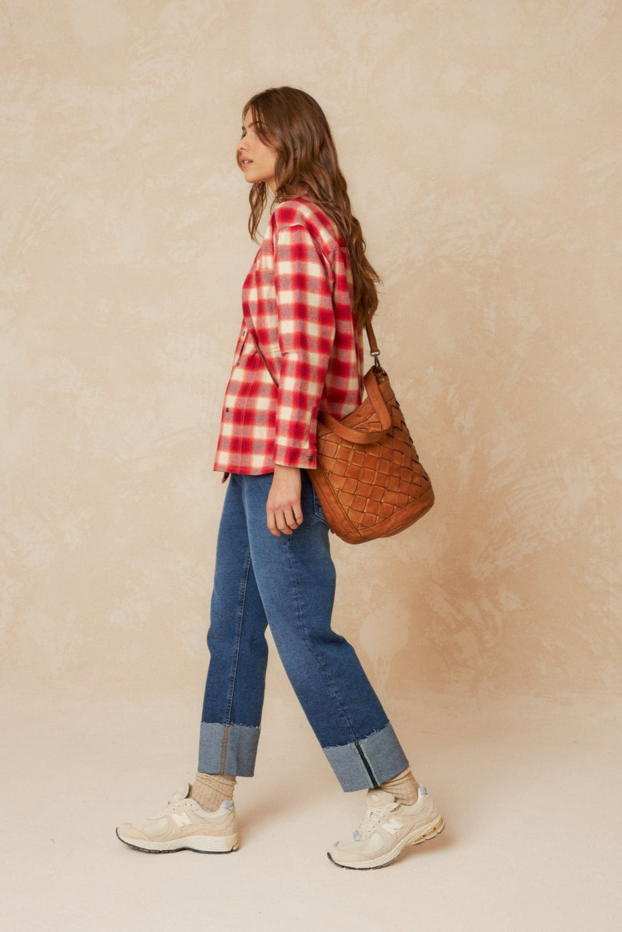 Red and white checkered over shirt with strip collar and square cut. 
