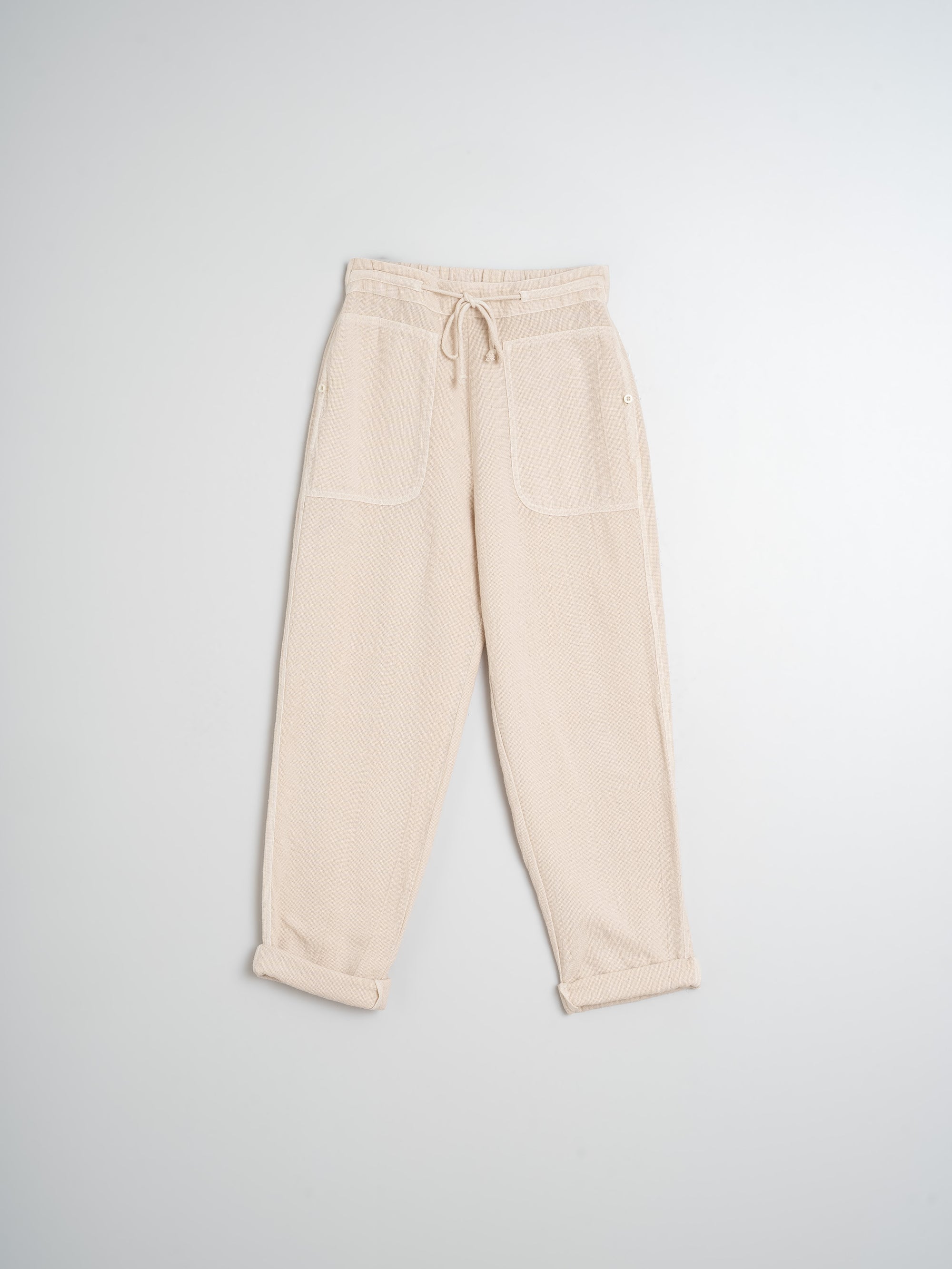 Beige pants on a light gray background