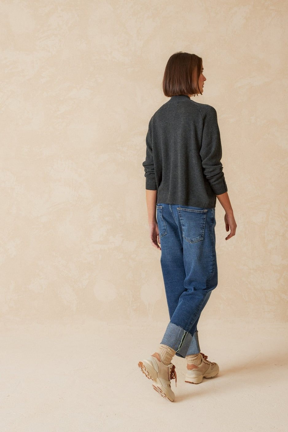 Grey knit long sleeve jumper with Perkins collar and raglan sleeve. 