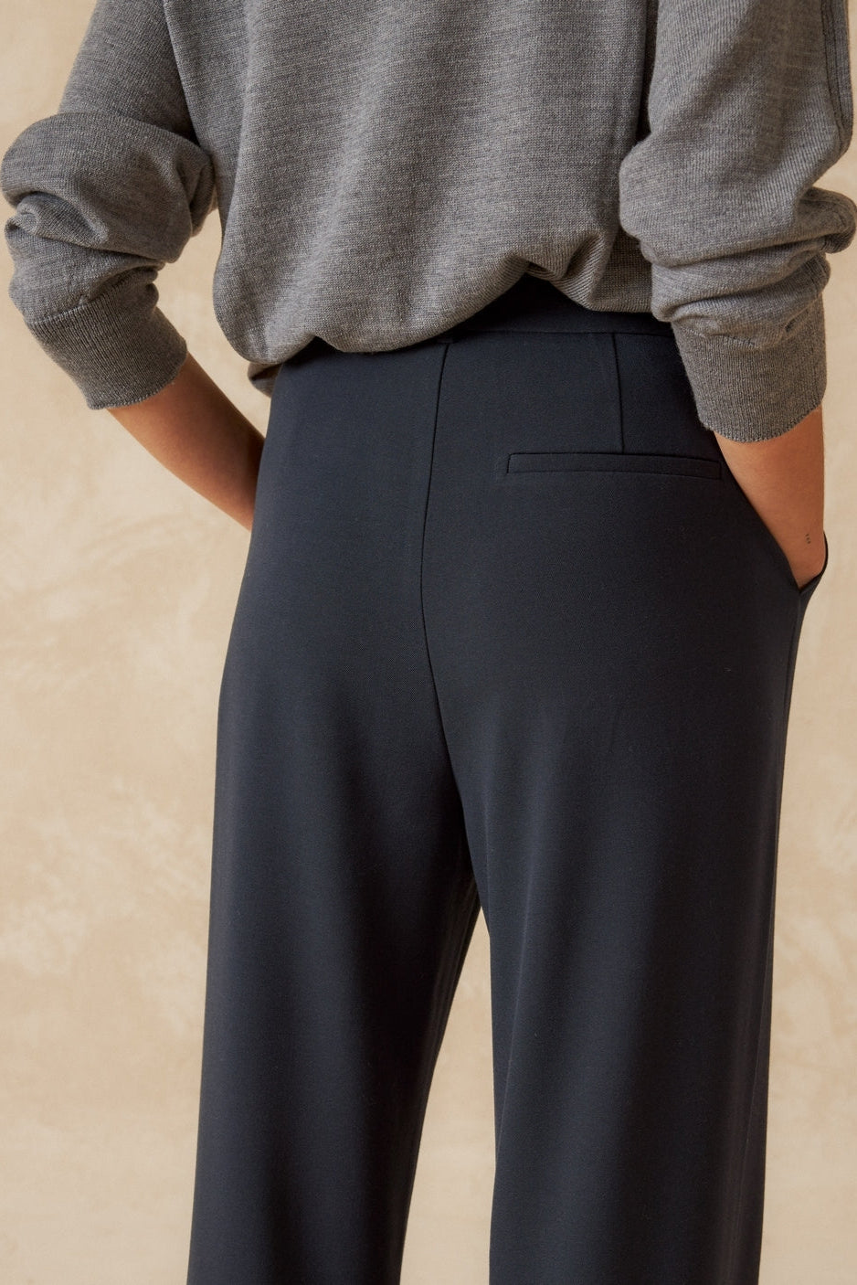 Navy wide leg pleated front pant. 