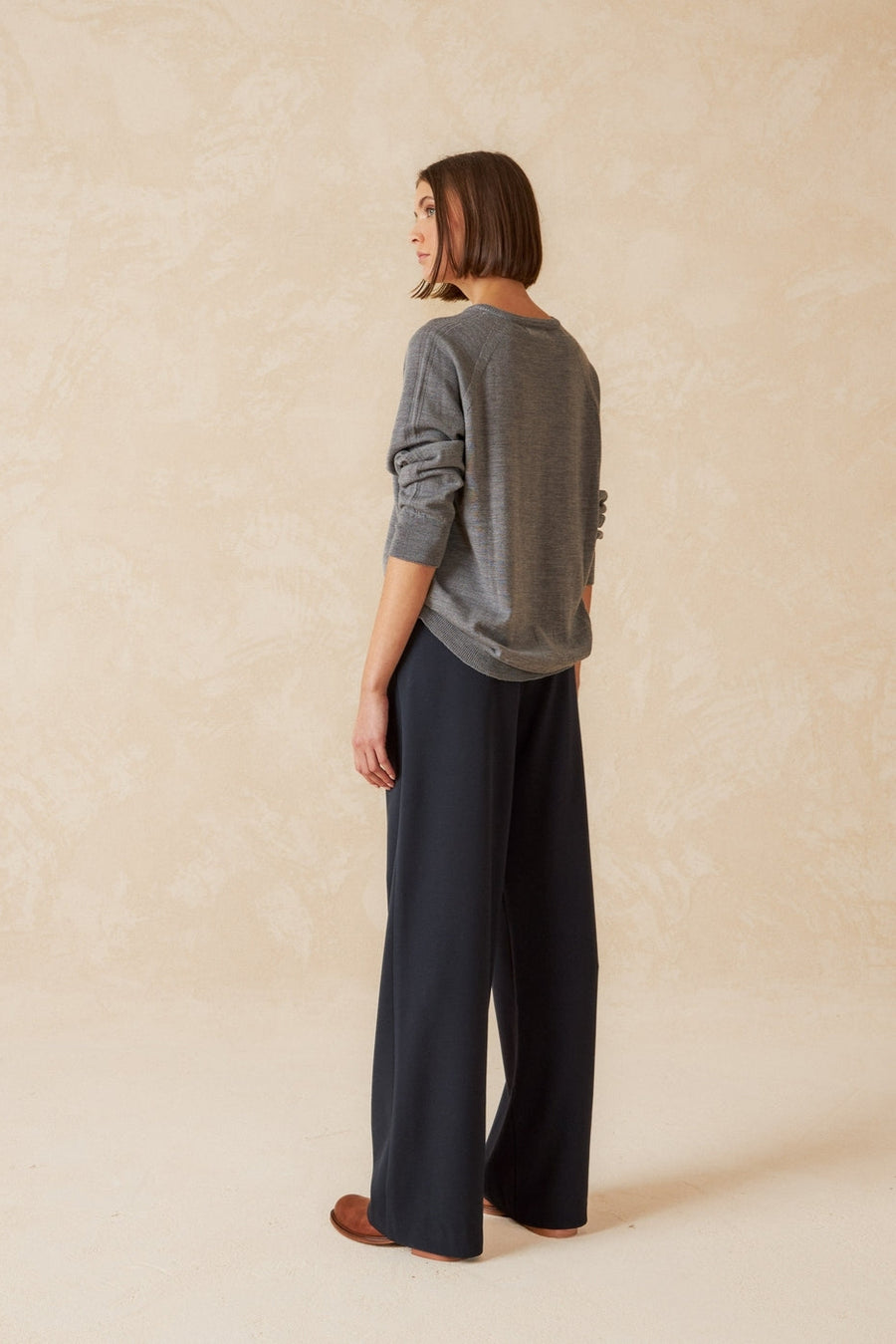 Navy wide leg pleated front pant. 