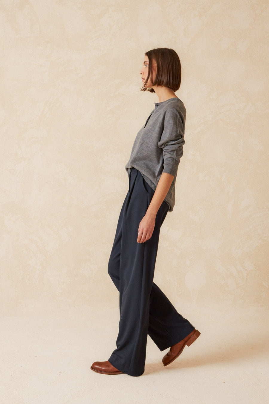 Navy wide leg pleated front pant. 