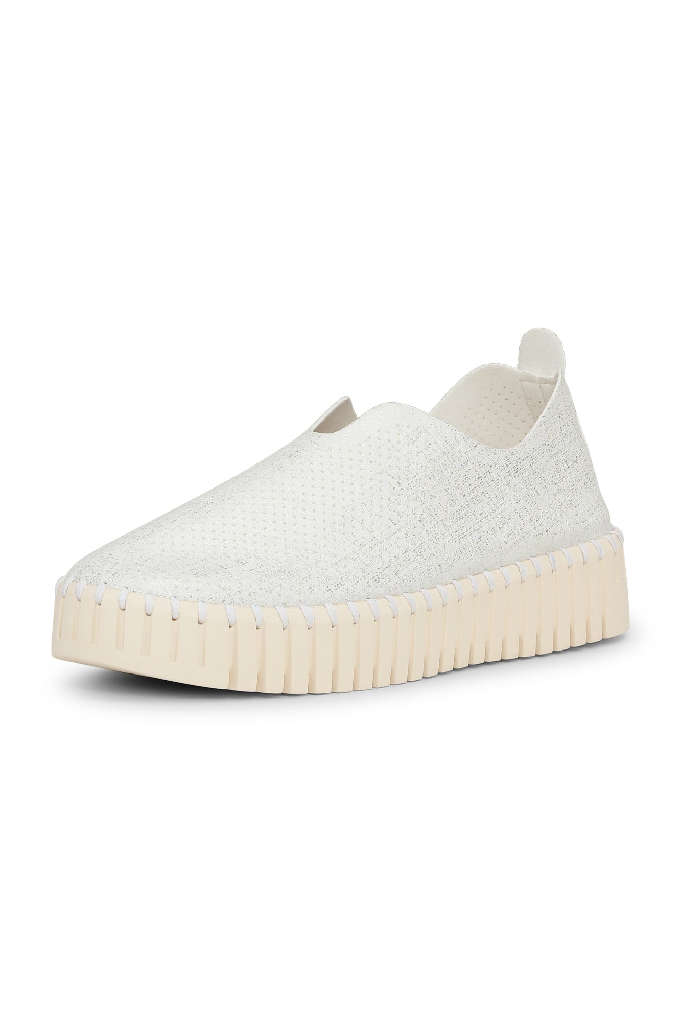 White slip-on sneaker with a thick sole on a white background