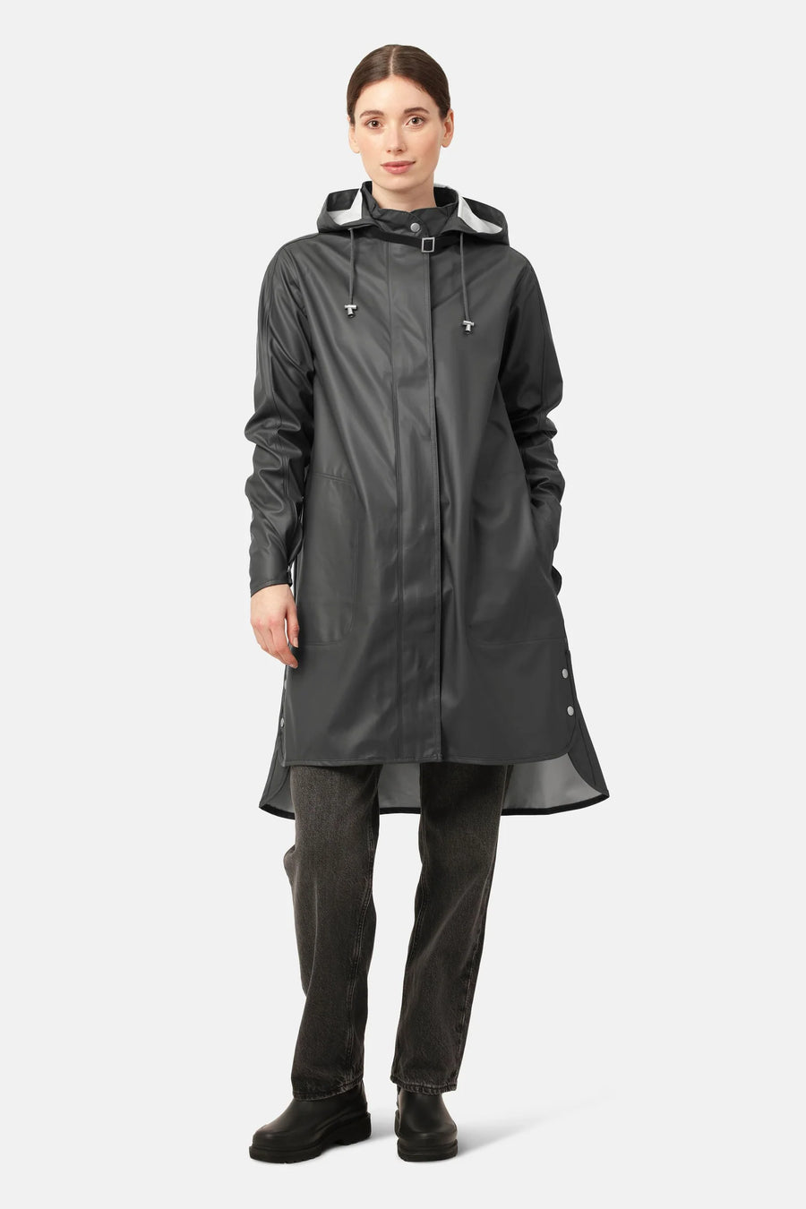 Knee length black rain coat with hood and hidden press buttons.