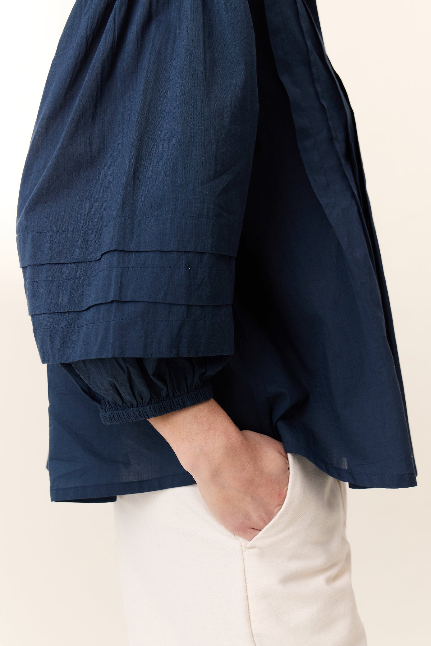 Navy blue  frill short sleeve shirt on a white background