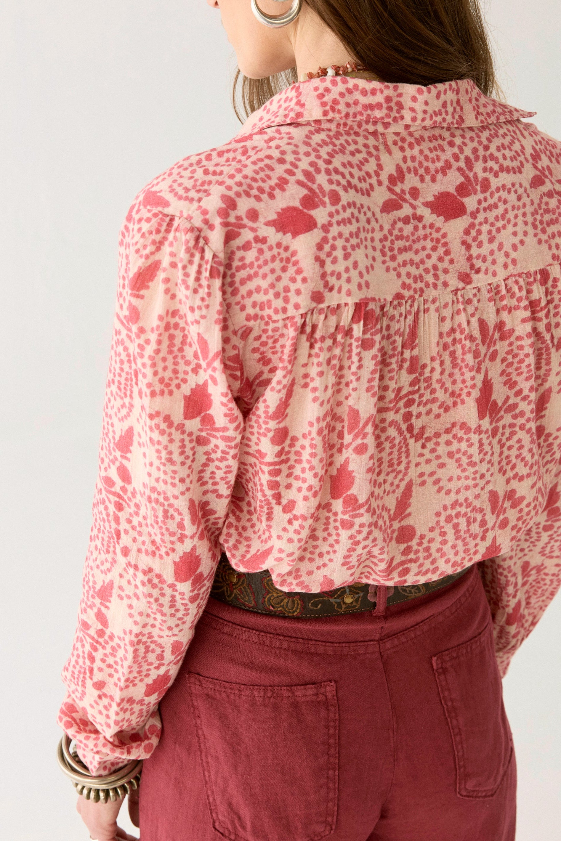 Pink and white floral blouse with open collar.  