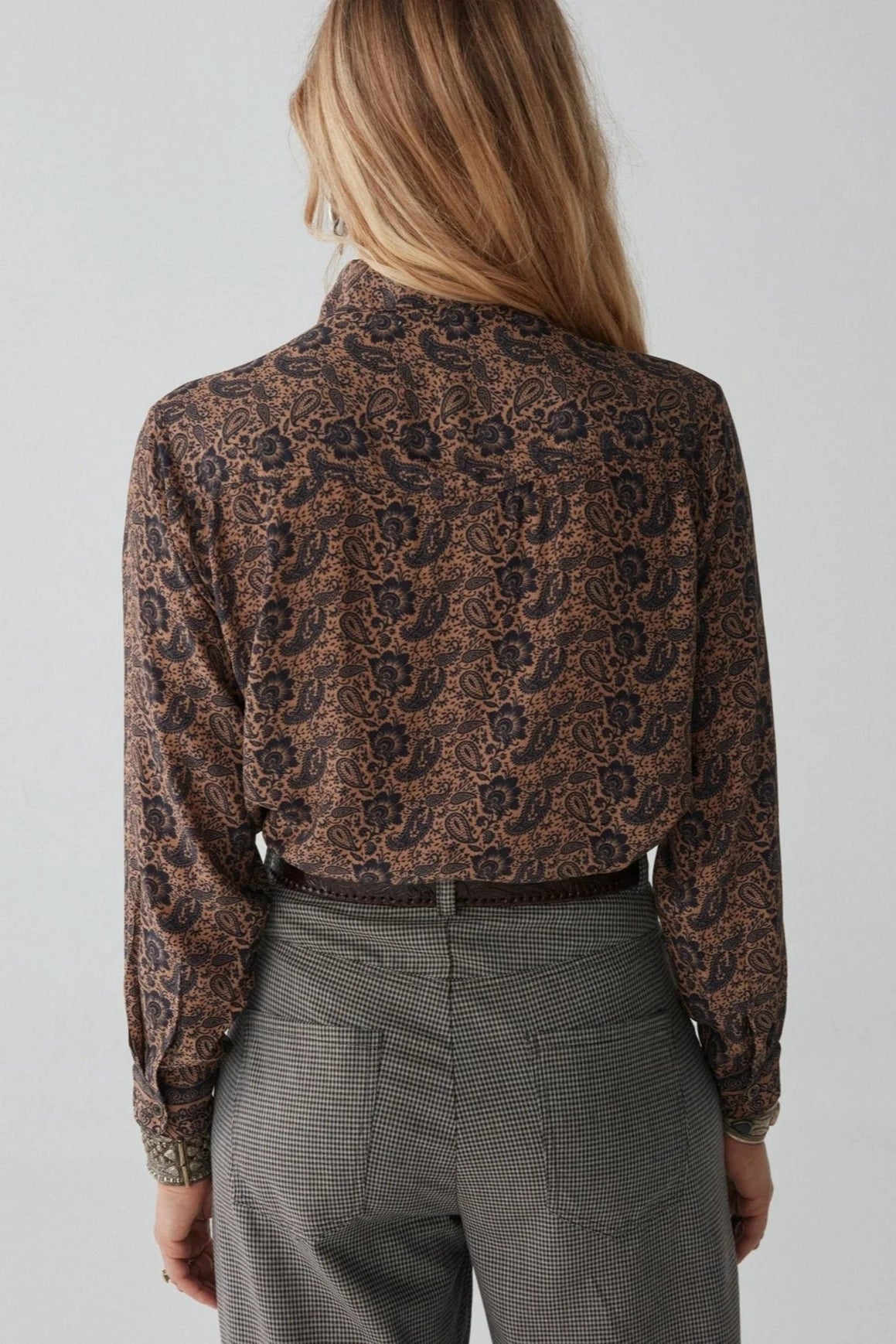 Long sleeve shirt with black and tan all over paisley print. 