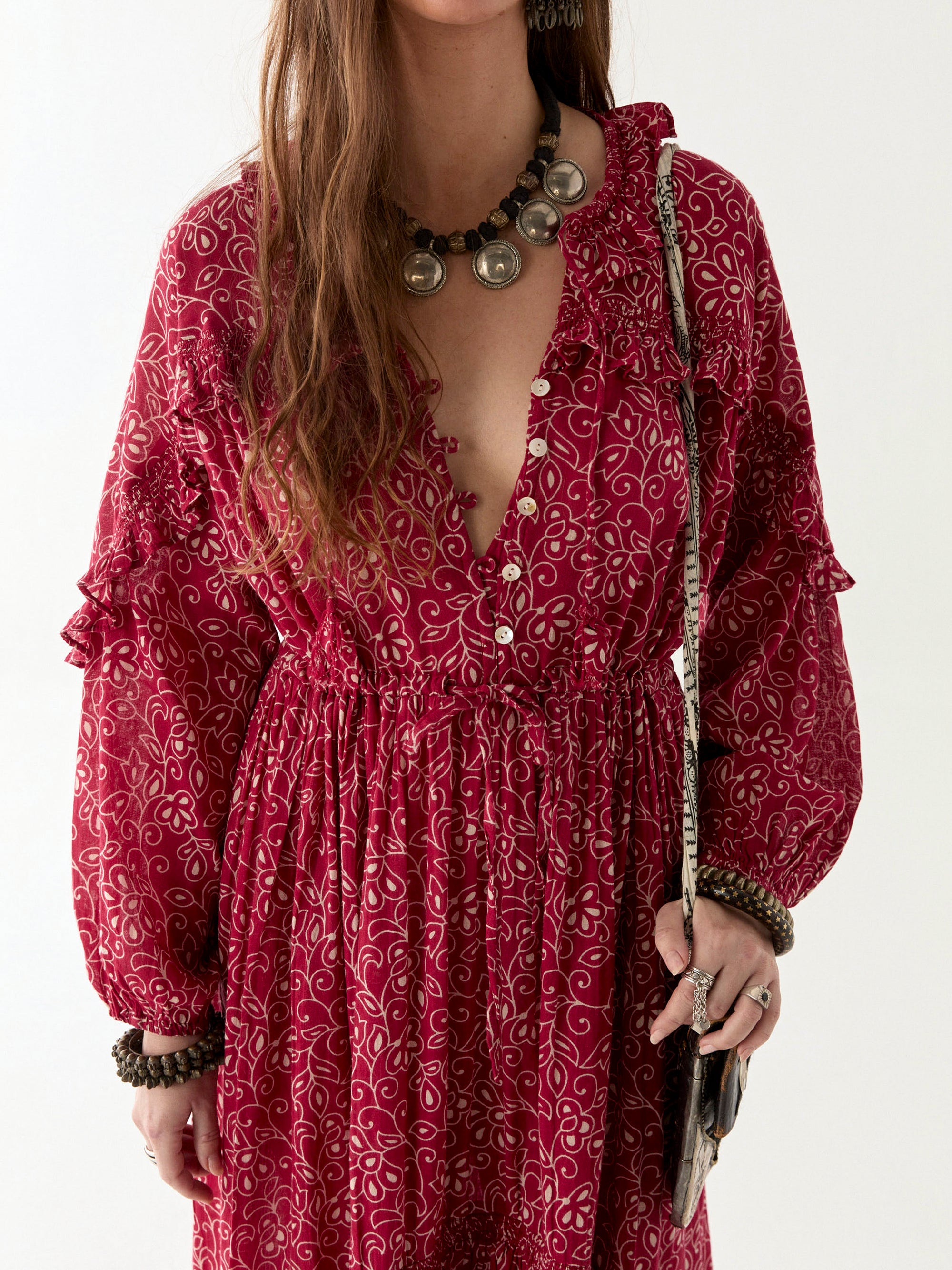 Chill red and ivory floral print floaty maxi dress worn by model on a white background. 