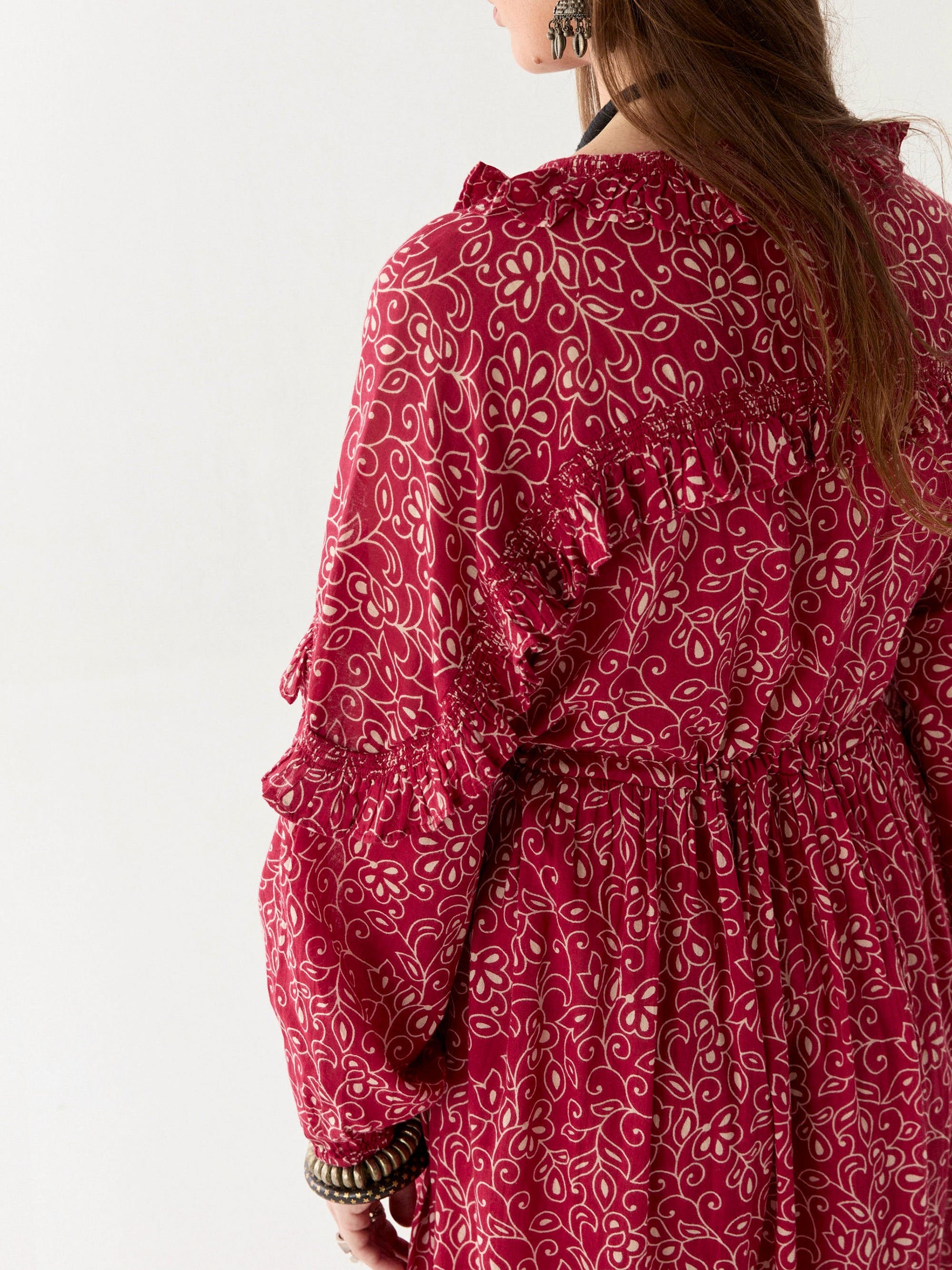 Chill red and ivory floral print floaty maxi dress worn by model on a white background. 