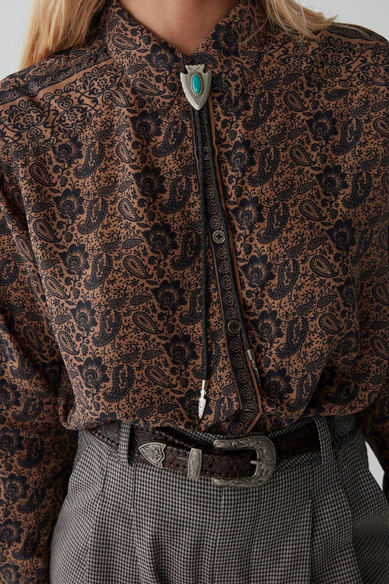 Long sleeve shirt with black and tan all over paisley print. 