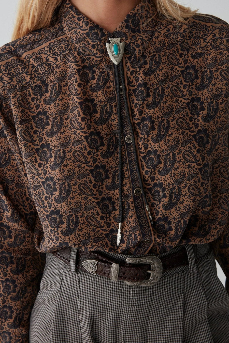 Long sleeve shirt with black and tan all over paisley print. 