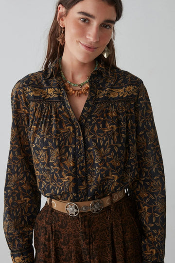 Shirt with a rich, hand-drawn floral print in deep golden and earthy tones