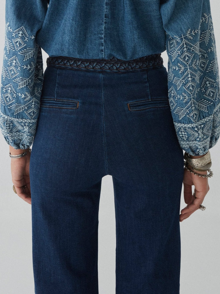 Long denim pants with braided waist detail 