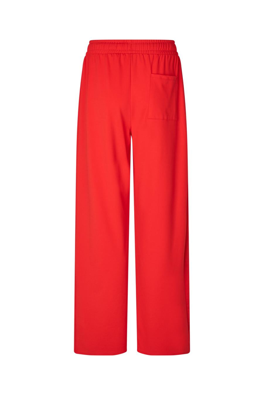 Red wide leg track pants on a white background