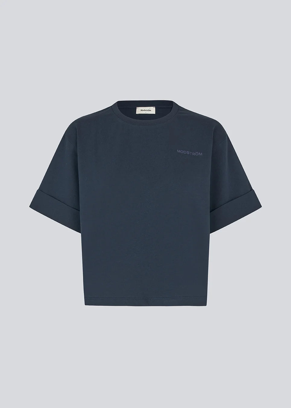 A dark navy blue short-sleeve t-shirt with rolled cuffs and a small tonal embroidered logo on the left chest, displayed against a solid light gray background.