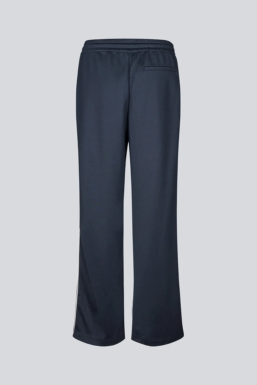 A pair of dark navy wide-leg pants with an elastic waistband and a side pocket, shown from the back on a light grey background.