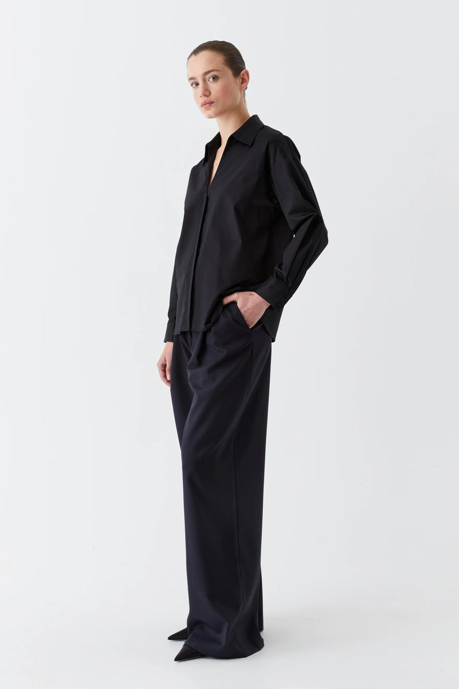 Black cotton sateen long sleeve shirt with v neck. 