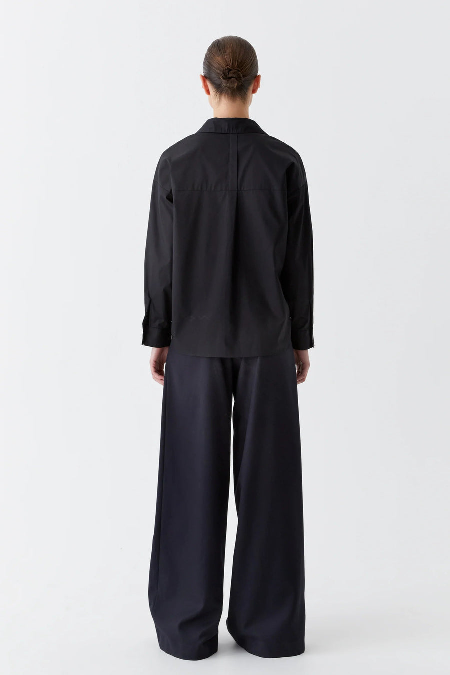 Black cotton sateen long sleeve shirt with v neck. 