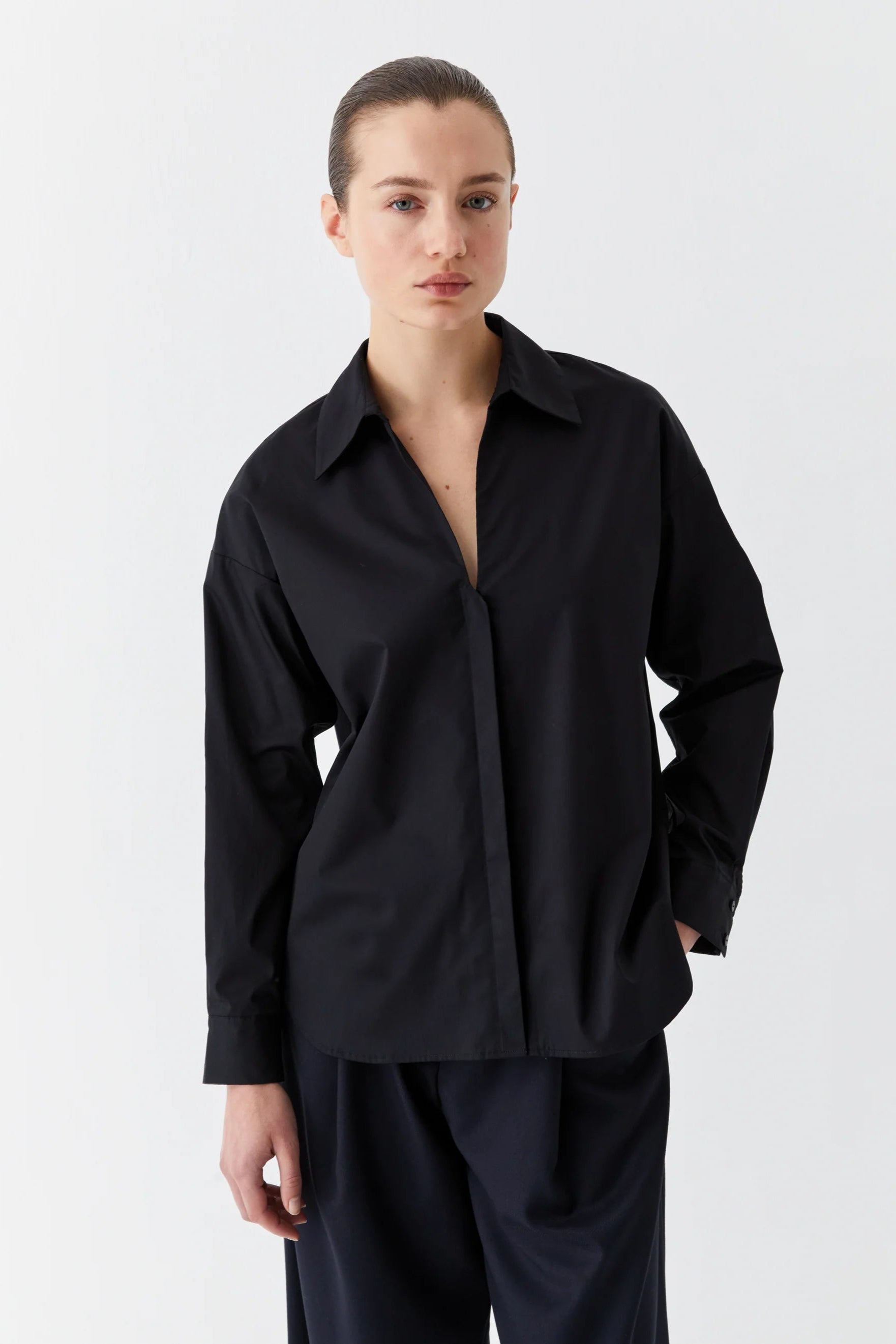 Black cotton sateen long sleeve shirt with v neck. 
