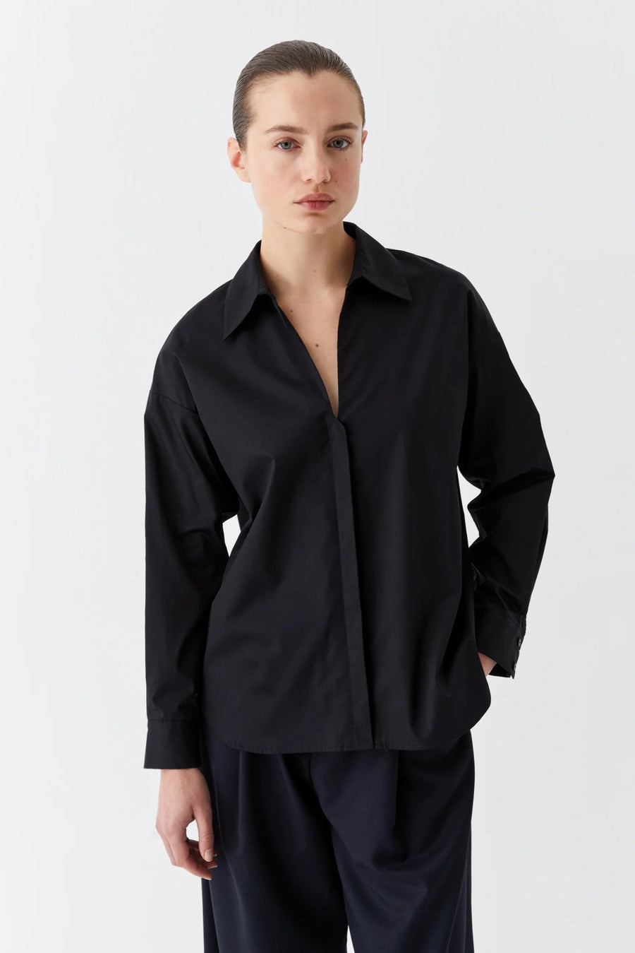 Black cotton sateen long sleeve shirt with v neck. 
